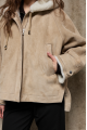 Stylish suede sheepskin coat made of natural sheepskin in beige color with a hood